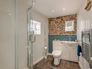a bathroom with a toilet and a glass shower at 1 Bed in Brixham oc-bx036 in Brixham +11 photos