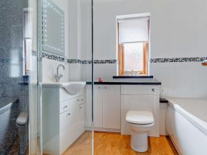 a bathroom with a toilet and a sink and a shower at 2 Bed in Wellington oc-00467 in West Buckland +9 photos