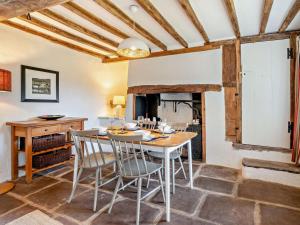 a dining room with a table and chairs at 2 Bed in Chepstow oc-42837 in Wolves Newton