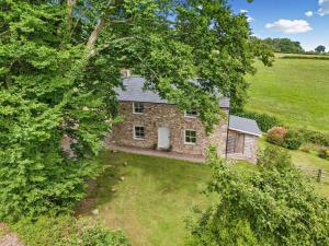 an aerial view of a stone house in a field at 2 Bed in Chepstow oc-42837 in Wolves Newton