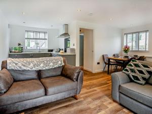 a living room with a couch and a kitchen at 1 Bed in Pontypool oc-83405 in Mamhilad