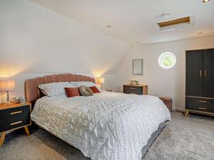 a bedroom with a large bed and a window at 1 Bed in Pontypool oc-83405 in Mamhilad