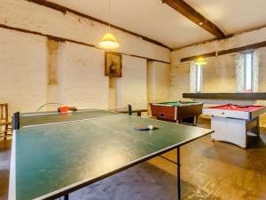 a ping pong room with a ping pong table at 3 Bed in Abergavenny oc-90233 in Llanvetherine