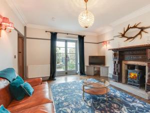 a living room with a couch and a fireplace at 2 Bed in Bakewell oc-91038 in Bakewell