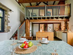 a table with a bowl of fruit on top of it at 3 Bed in Llandovery oc-bn093 in Llandovery