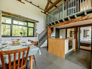 a kitchen and dining room with a table and chairs at 3 Bed in Llandovery oc-bn093 in Llandovery +23 photos