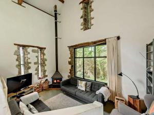a living room with a couch and a fireplace at 3 Bed in Llandovery oc-bn093 in Llandovery