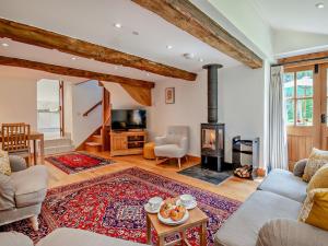 a living room with a wood burning stove in it at 2 Bed in Chepstow oc-95046 in Chepstow