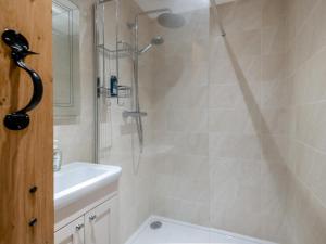 a bathroom with a shower and a sink at 2 Bed in Chepstow oc-95046 in Chepstow +30 photos