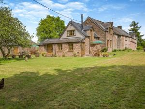 a large stone house with a large yard at 2 Bed in Chepstow oc-95046 in Chepstow