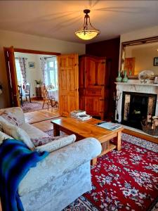 a living room with a couch and a coffee table at Lake Avenue House in Ballyconnell