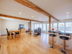 a large living room with a table and chairs at 1 Bed in Faringdon oc-88573 in Coxwell