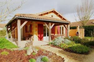 a small house with a red and yellow at 2025 Reno 2-Bed Escape w pool Min to GolfCources in Les Forges