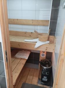 a sauna with a wooden shelf in a room at Chata košaríska in Oščadnica +18 photos