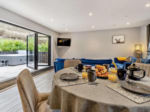 a dining room with a table and a couch at 2 Bed in Knighton oc-94202 in Knighton +21 photos