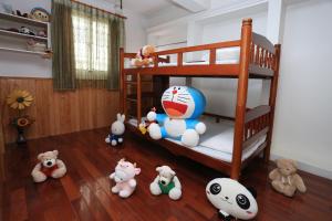 Una cama o camas en una habitación de Yilan Homeland B&B