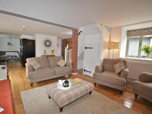 a living room with two couches and a table at 3 Bed in North Tawton oc-66043 in Winkleigh +8 photos