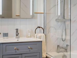 a bathroom with a sink and a shower at 3 Bed in Brecon oc-96240 in Llandefaelogfâch +30 photos