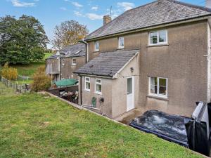 a house with a swimming pool in front of it at 3 Bed in Brecon oc-96240 in Llandefaelogfâch