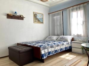 a bedroom with a bed and a window at Historic House in the Heart of Old Town Sozopol in Sozopol