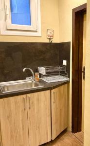 a kitchen counter top with a sink and a sink at Historic House in the Heart of Old Town Sozopol in Sozopol +31 photos