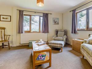 a living room with a couch and a chair at 2 Bed in Builth Wells oc-bn201 in Aberedw