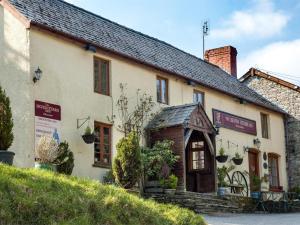 an old building with a sign on the side of it at 2 Bed in Builth Wells oc-bn201 in Aberedw