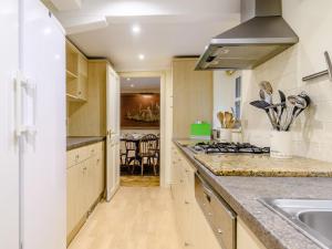 a kitchen with a sink and a stove top oven at 3 Bed in Presteigne oc-78336 in Evenjobb
