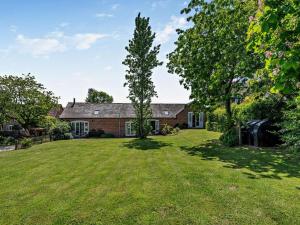 a house with a tree in the yard at 1 Bed in Craven Arms oc-54928 in Clungunford