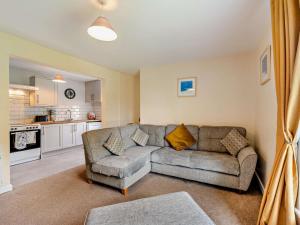a living room with a couch and a kitchen at 2 Bed in Bideford oc-40281 in Northam