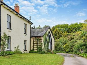 an old house with a grass yard in front of it at 2 Bed in Bideford oc-40281 in Northam