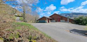 a house on the side of a road at Le Chalet des Côtes in Cornimont