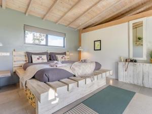 a bedroom with two beds on a wooden platform at 1 Bed in Llandrindod Wells oc-53194 in Llandrindod Wells +23 photos