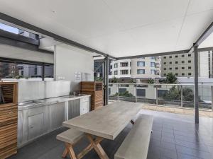 a large kitchen with a table and a large window at CITY Centre With Awesome Views! in Brisbane