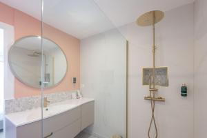 a bathroom with a sink and a mirror at Sweett - Maison Blanche in Juan-les-Pins +16 photos