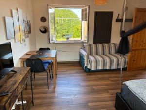 a living room with a table and a couch at Terra in Valledoria