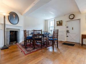 a dining room with a table and chairs and a fireplace at 3 Bed in Ludlow oc-82889 in Ludlow