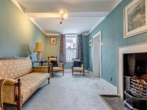 a living room with a couch and a fireplace at 3 Bed in Ludlow oc-82889 in Ludlow