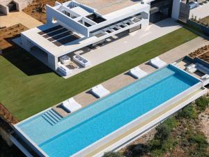 an aerial view of a villa with a swimming pool at Oliva D'oro Villa - Sunset Gaze by etouri in Chania
