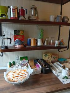 a kitchen counter with a pie and other food items at Casa Laura in Modigliana +9 photos