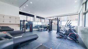 a gym with several treadmills and bikes in it at The Nestle & The Cradle - Kileleshwa in Nairobi