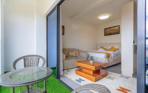 a living room with a couch and a table at The Nestle & The Cradle - Kileleshwa in Nairobi +65 photos