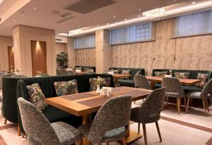 a restaurant with tables and chairs in a room at Grand Hilarium Hotel in Istanbul