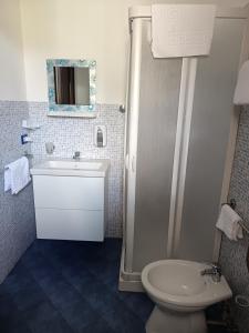 a bathroom with a toilet and a sink and a shower at A due passi dal mare in Capo dʼOrlando