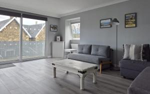 a living room with a couch and a coffee table at Dunuaran in Oban