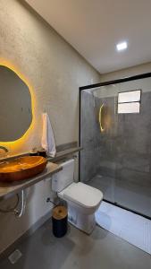 a bathroom with a sink and a toilet and a shower at Pousada Verdes dos Corais in São Miguel dos Milagres +21 photos