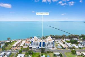 an overhead view of a building in a parking lot at Oceanfront Spa Suite - Sub Penthouse in Urangan +31 photos