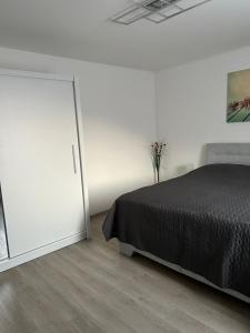 a bedroom with a bed and a mirror at Na Písku in Most