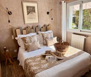 a bedroom with a large bed with a basket on it at Casa del Sole Chambres d'Hotes de Charme in Favone +64 photos
