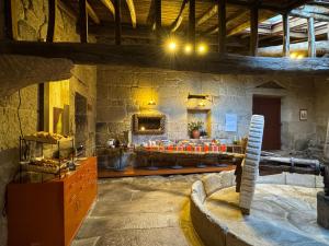 a large stone building with aasteryasteryasteryasteryasteryasteryasteryasteryasteryastery at Pousada Torre Lombarda in Allariz